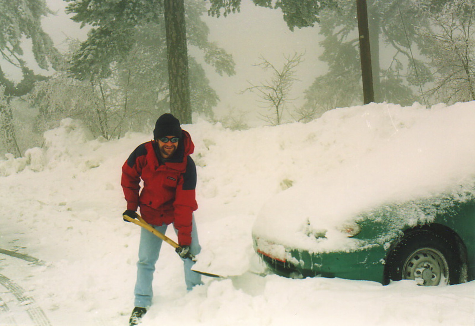 Mark digging a car out of a snowdrift