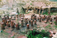 Columns of bricks from an under-floor heating system