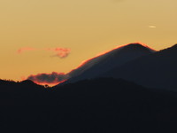 The sun rising behind Volcán Agua and Actenango
