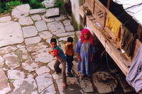 A mother and two children in Bhagsu