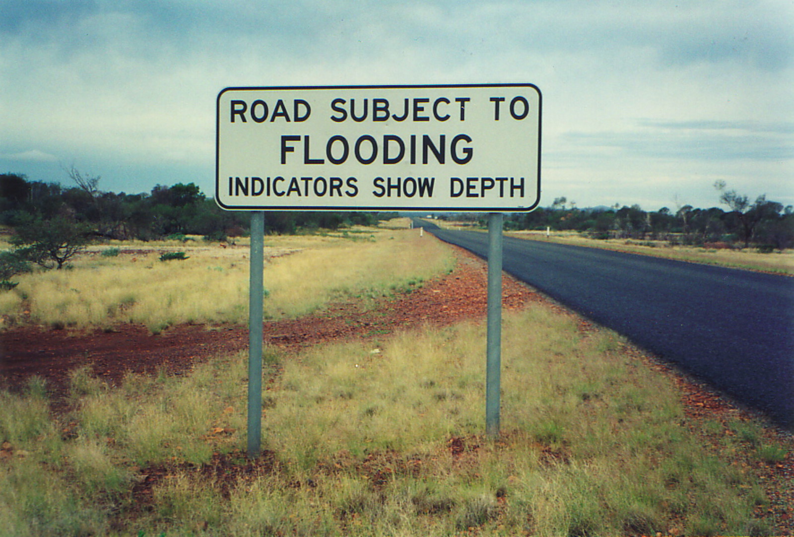 A sign warning of potential flooding