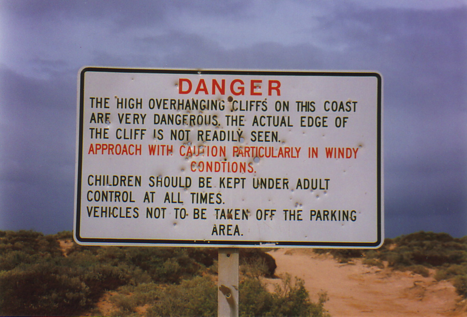 A sign warning of the Nullarbor's dangerous cliffs