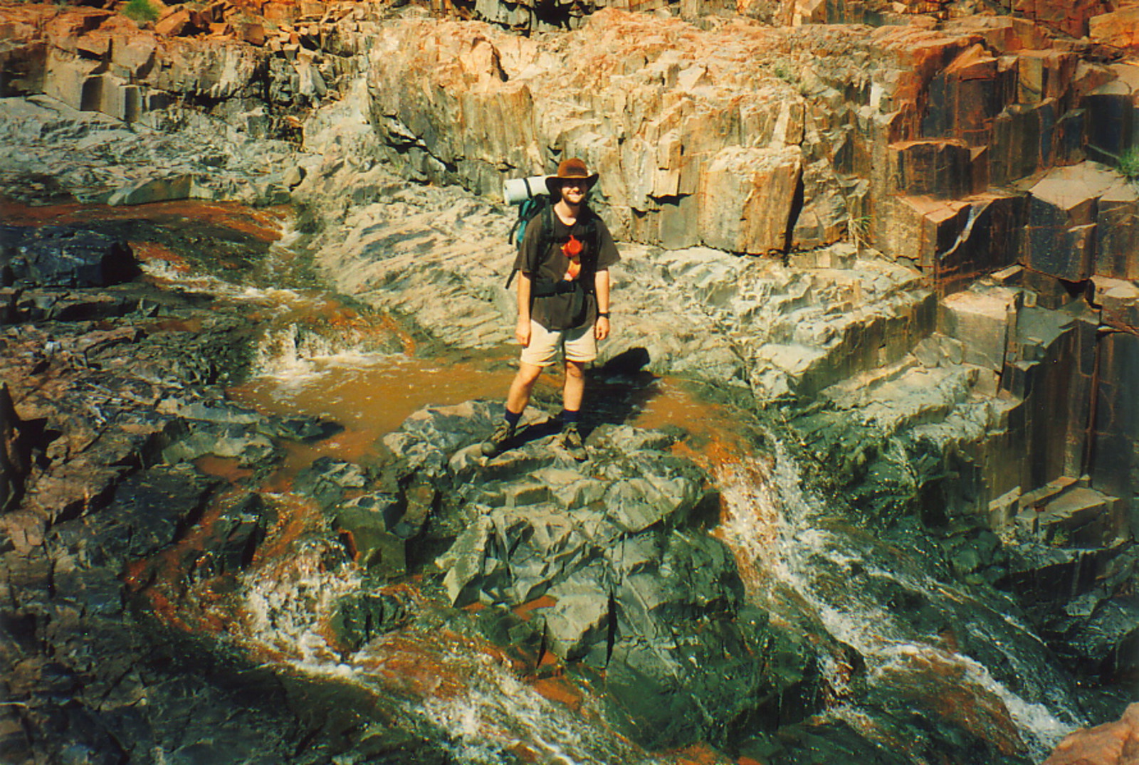 Mark crossing a slippery outback creek