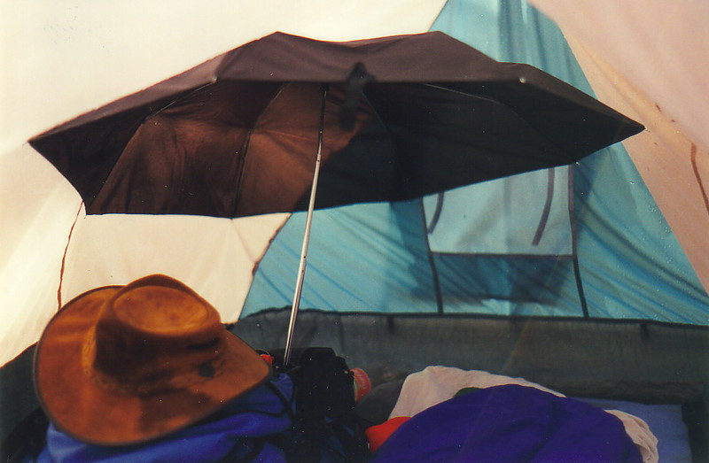 An umbrella inside a tent
