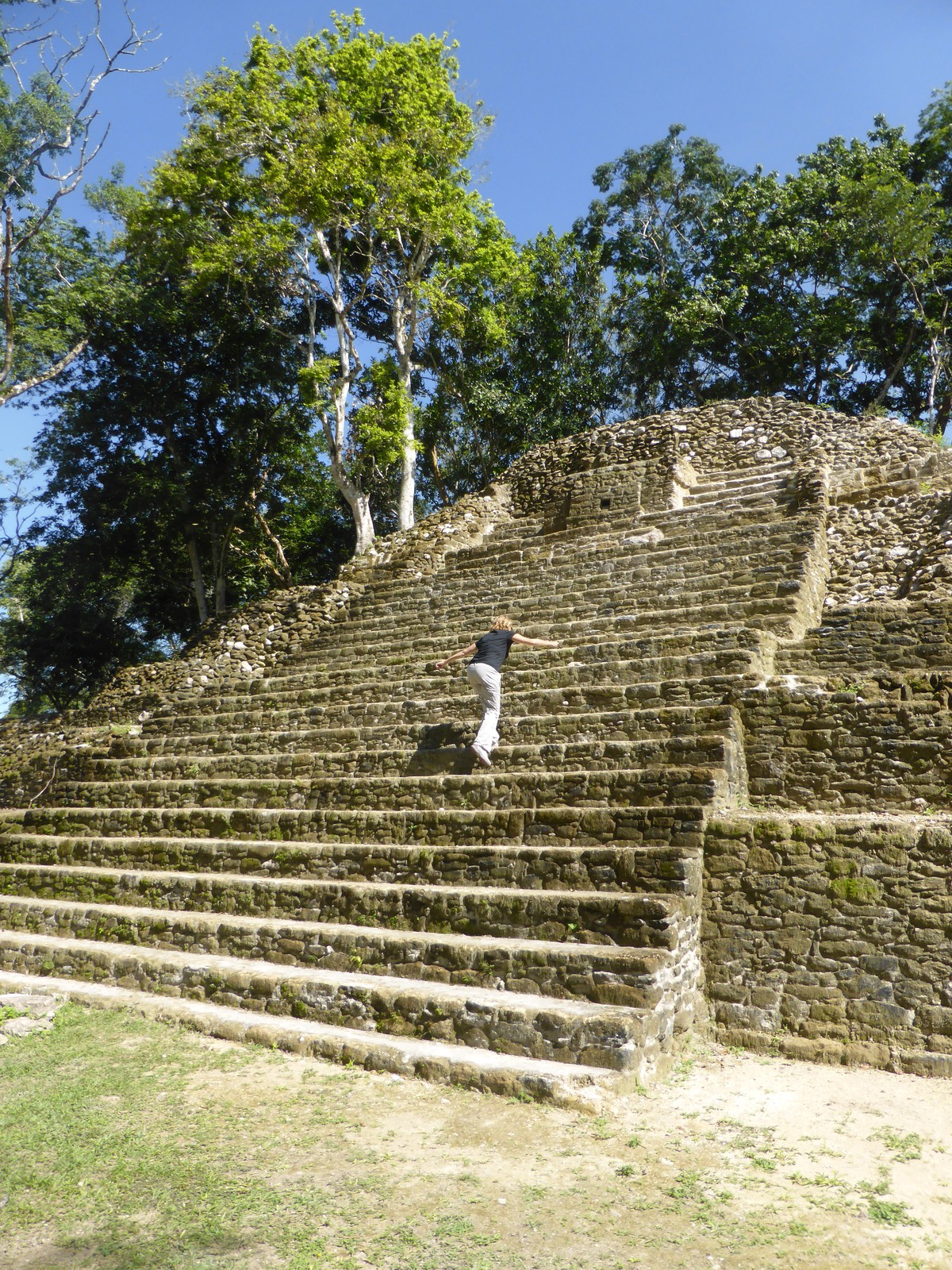 Peta climbing the pyramid at Cahal Pech