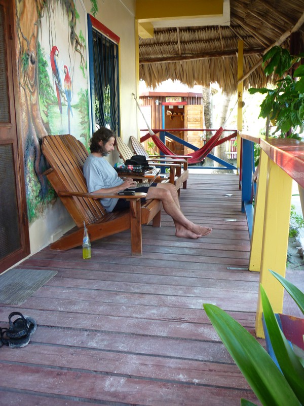 Mark writing on the balcony in Caye Caulker
