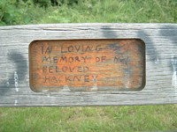 Graffiti on a bench opposite the Lesney Industries factory that says 'In loving memory of my beloved Hackney'