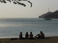 People relaxing on the beach in Taganga