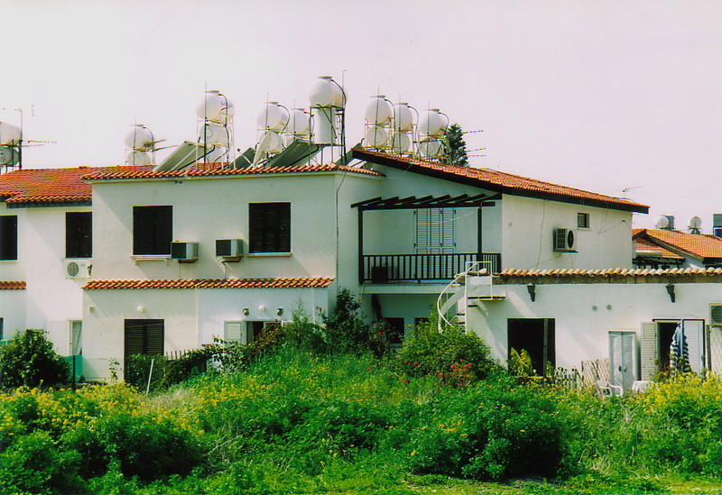 Solar-powered water heaters on a roof