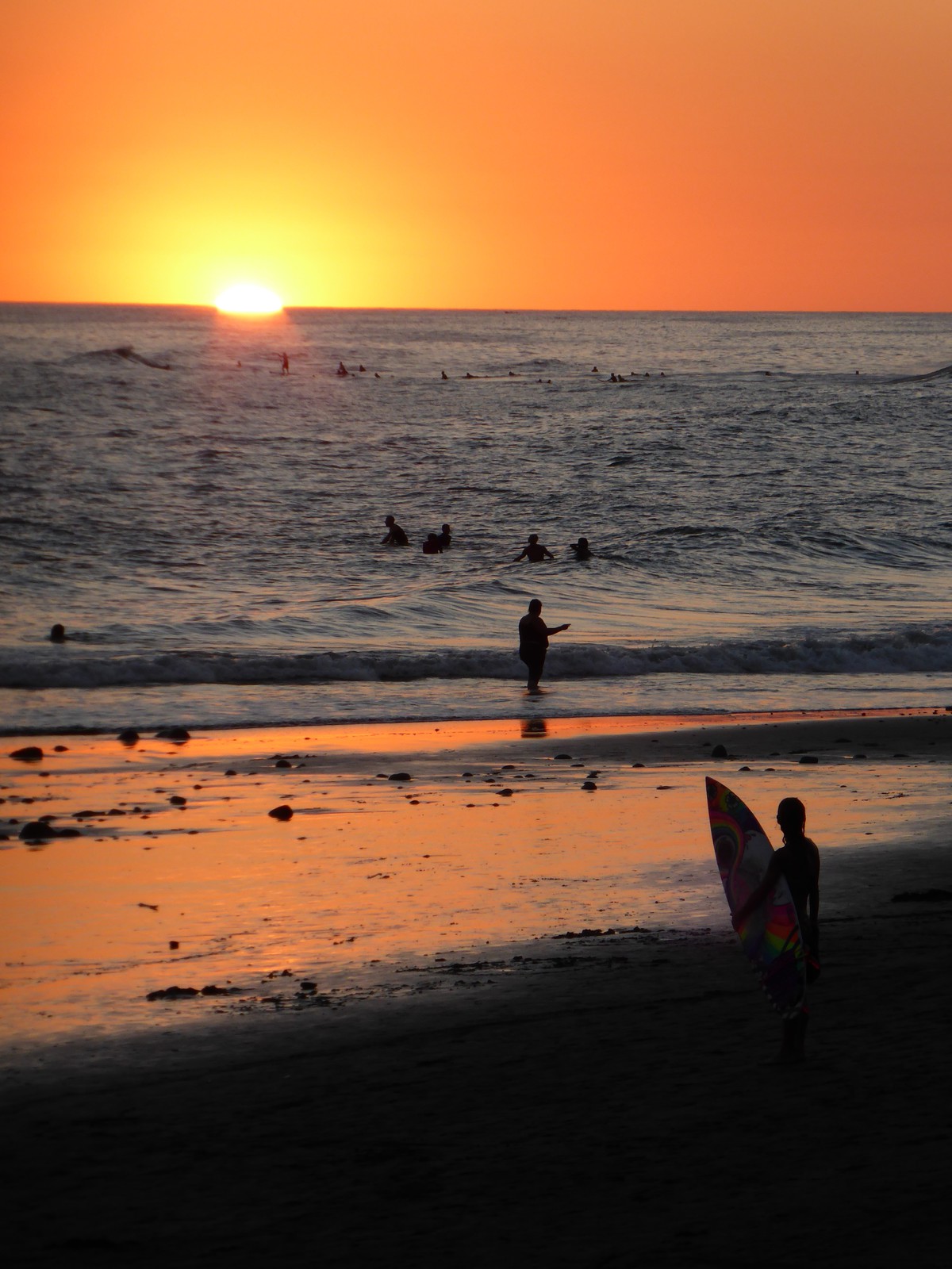 Sunset and surfers