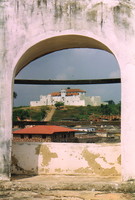 Fort St Jago seen through an arch in St George's Castle