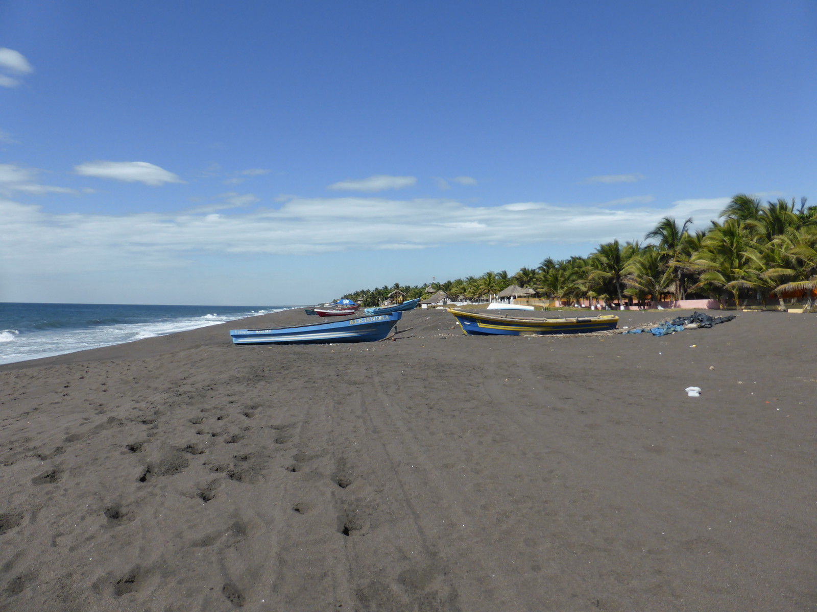 Looking north along the black sands of Monterrico beach