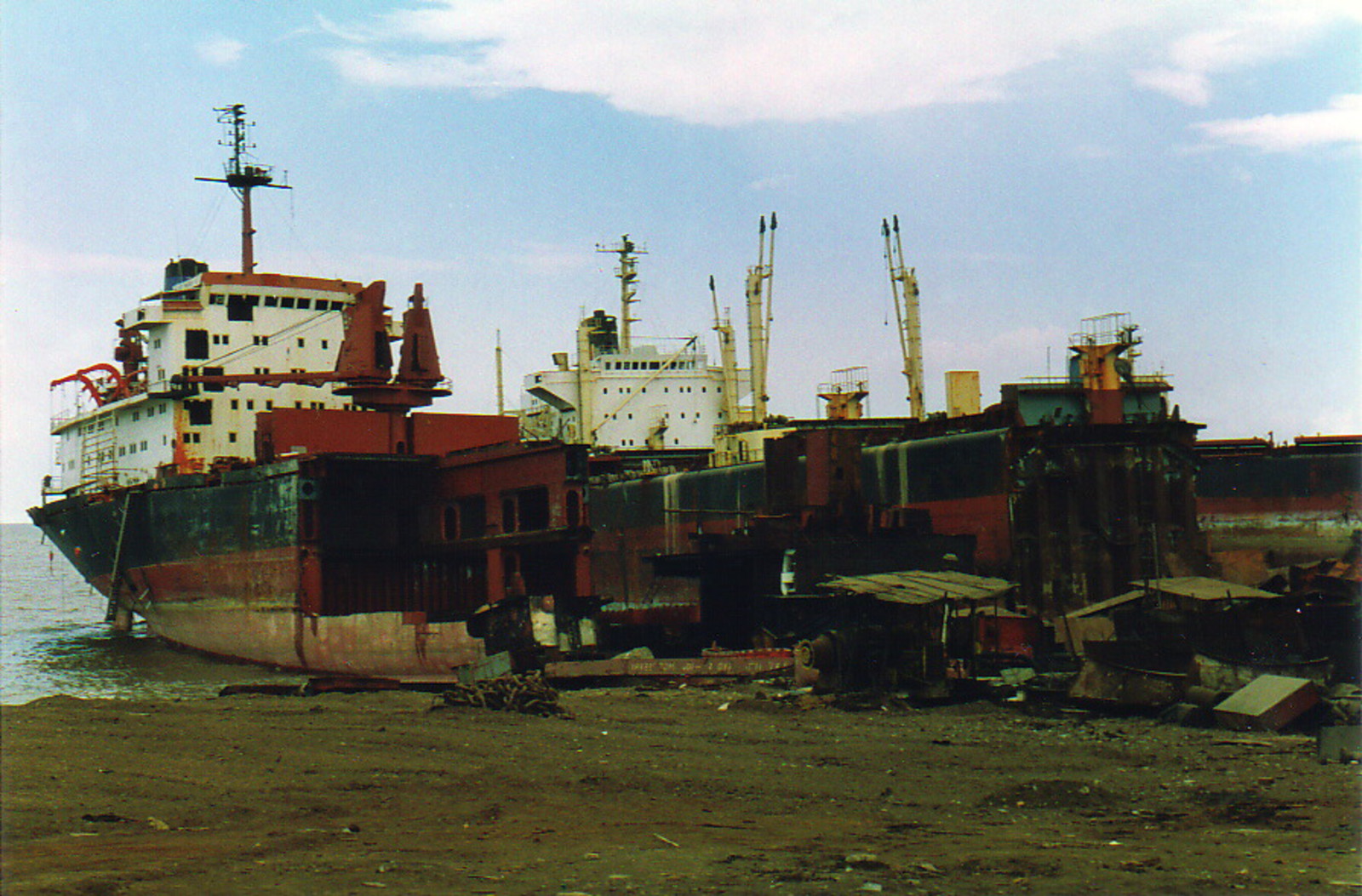 Two ships next to each other on the beach