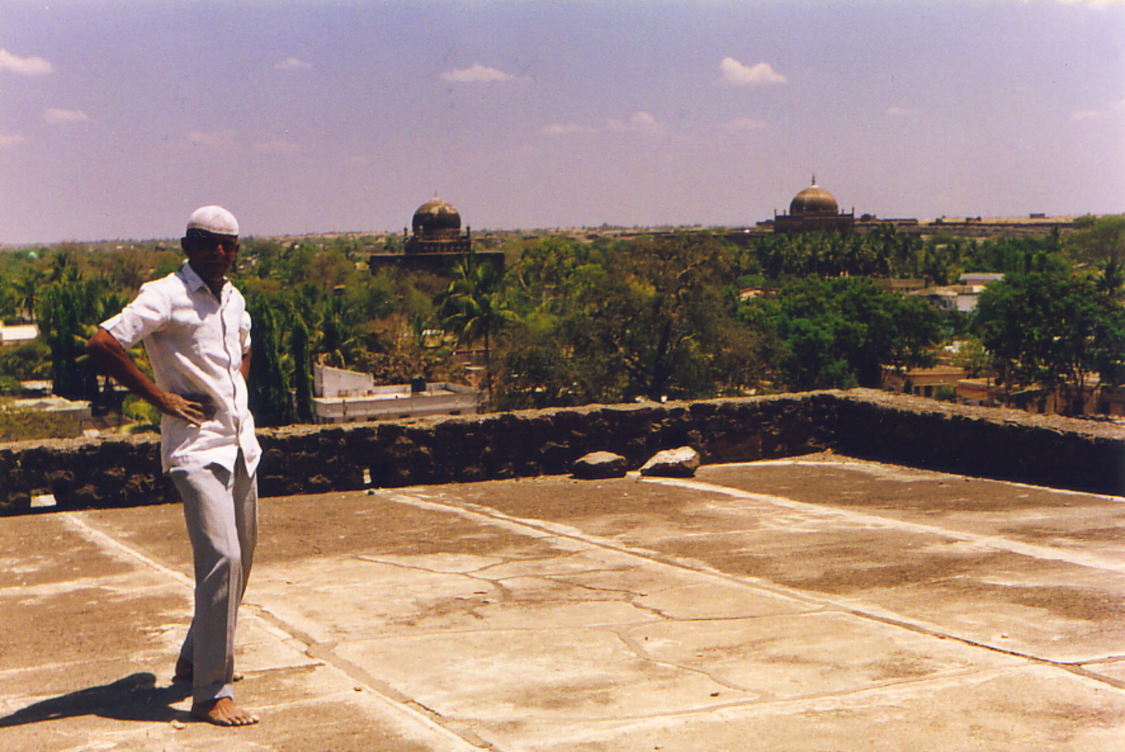 A man on a roof in Bijapur