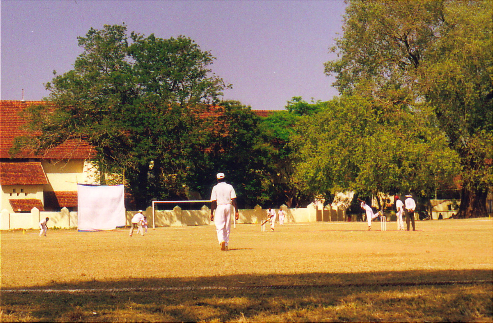 Sunday cricket on the green in front of St Francis' Church