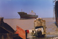 A ship anchored off the shore at Alang