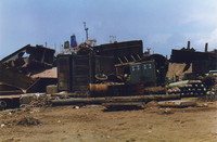 Piles of ship parts in the yards of Alang