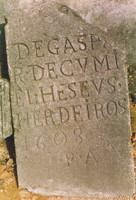 A carved stone slab covered in Latin