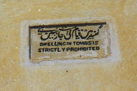 A sign on the Qutab Shahi Tombs in Golconda forbidding 'dwelling in the tombs'