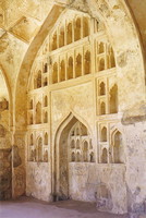 Carved alcoves set into a wall in Golconda