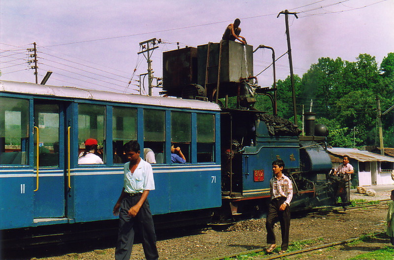 The Toy Train being refuelled from a large roadside tank