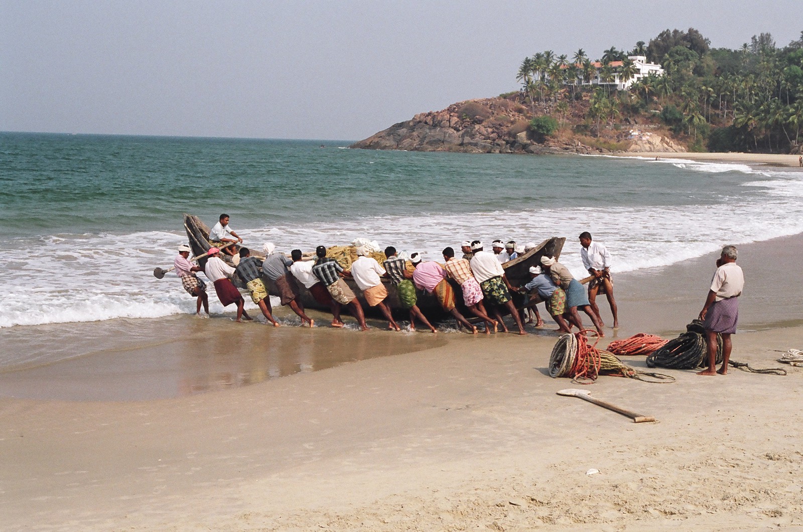 Fishermen launching their boat