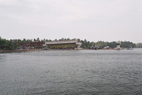 A large, half-built bridge spanning the backwaters