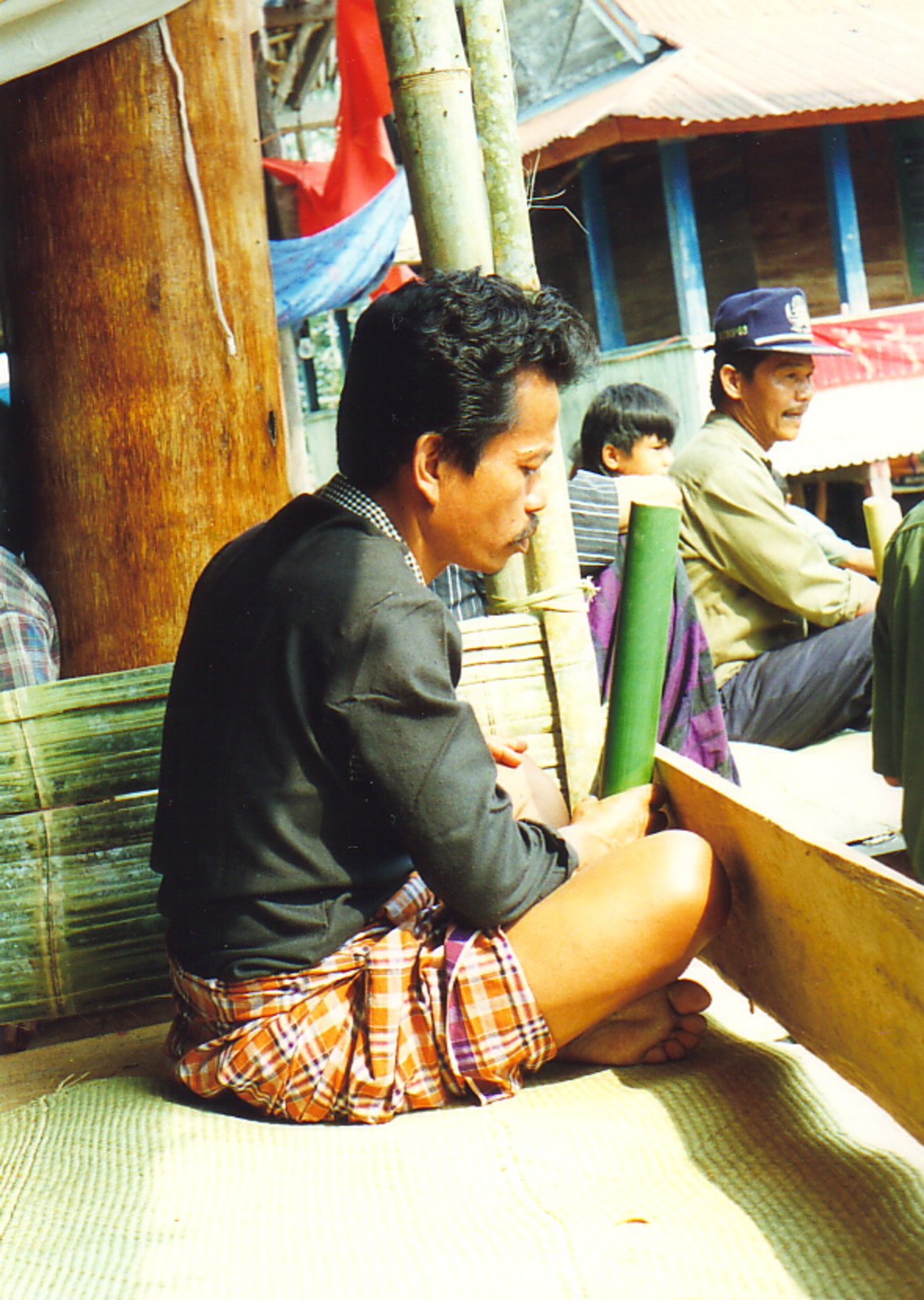 A man drinking tuak