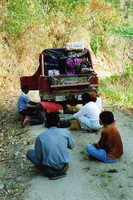 Men fixing a Jeep in the Bada Valley