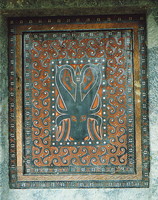 A water buffalo on the door to a Torajan grave