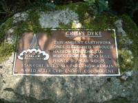 A sign at Grim's Dyke, saying 'This ancient earthwork once stretched through Harrow for some six miles from Cuckoo Hill, Pinner to Pear Wood, Stanmore, but only parts now remain. Named after Grim (Norse god Woden)'