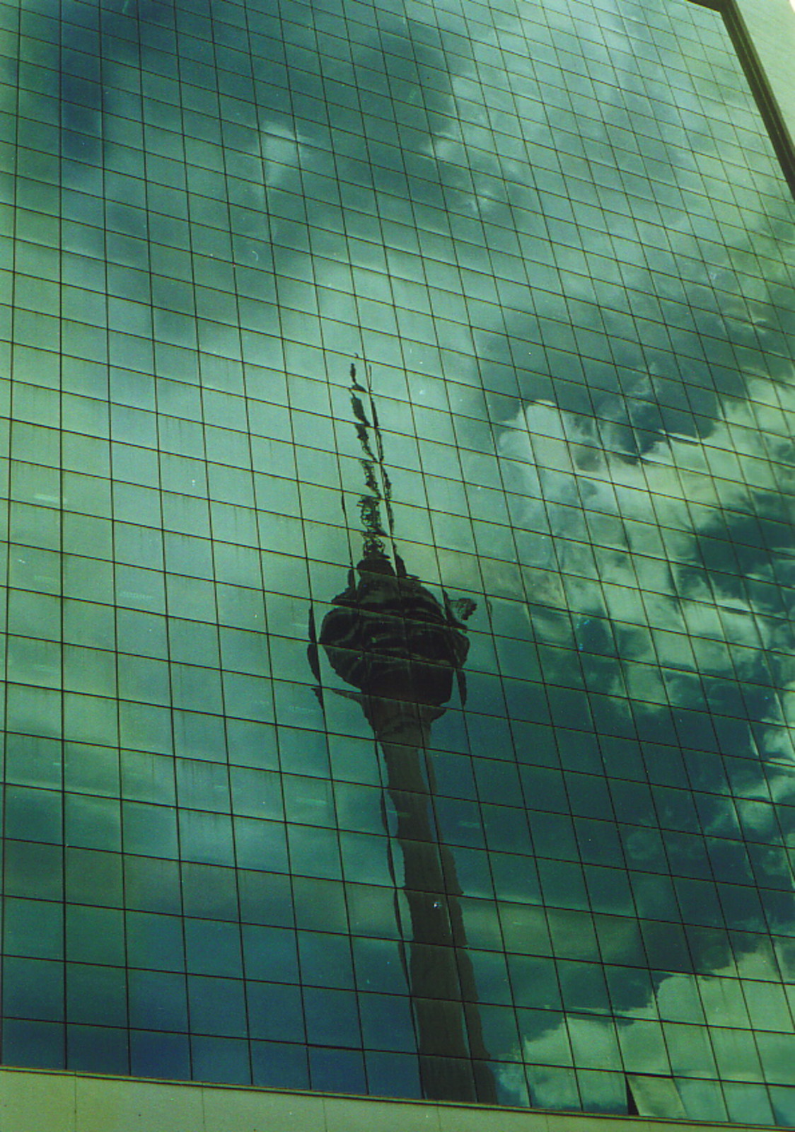 The Menara Kuala Lumpur reflected in a skyscraper