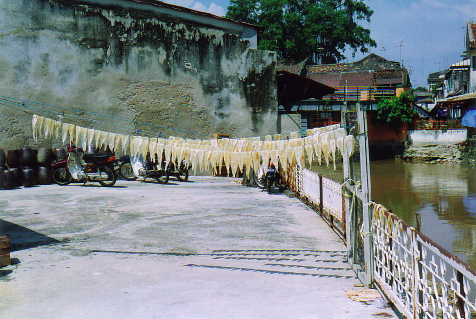 Fish drying by the river in Old Melaka