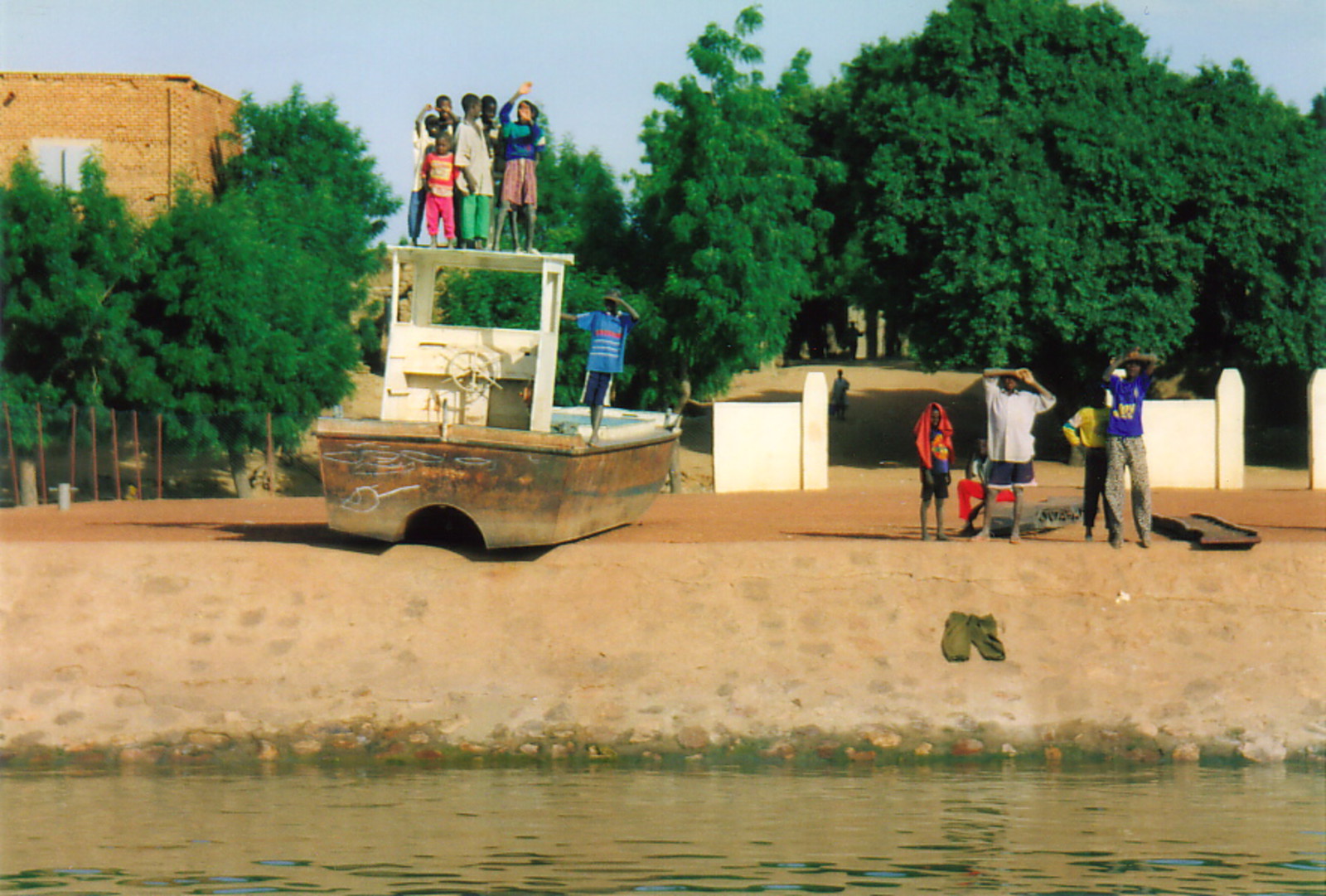 A beached fishing trawler on the banks of the River Niger