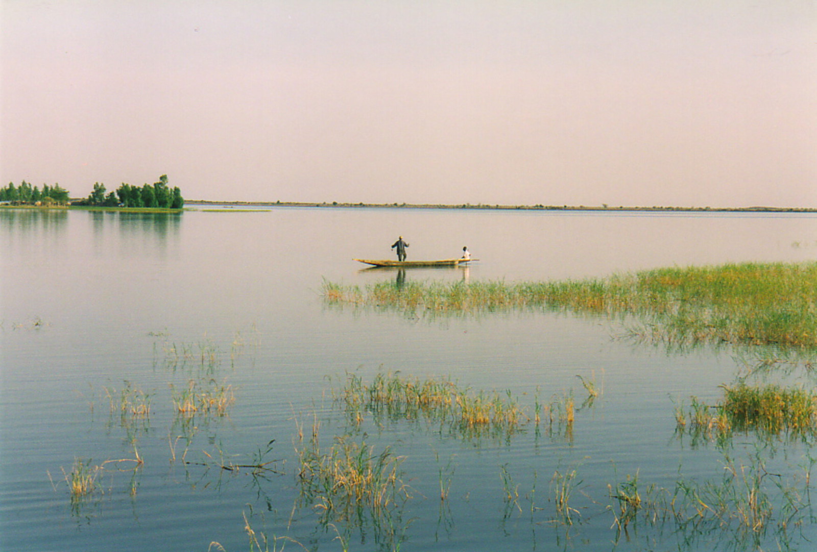 A fisherman in a boat on the River Niger near Tonka