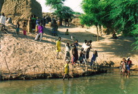 Locals rushing down to the banks of the River Niger