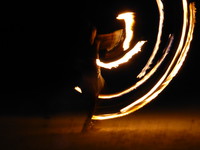 Fire juggling on the beach at Fusion