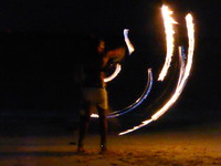 Fire juggling on the beach at Fusion