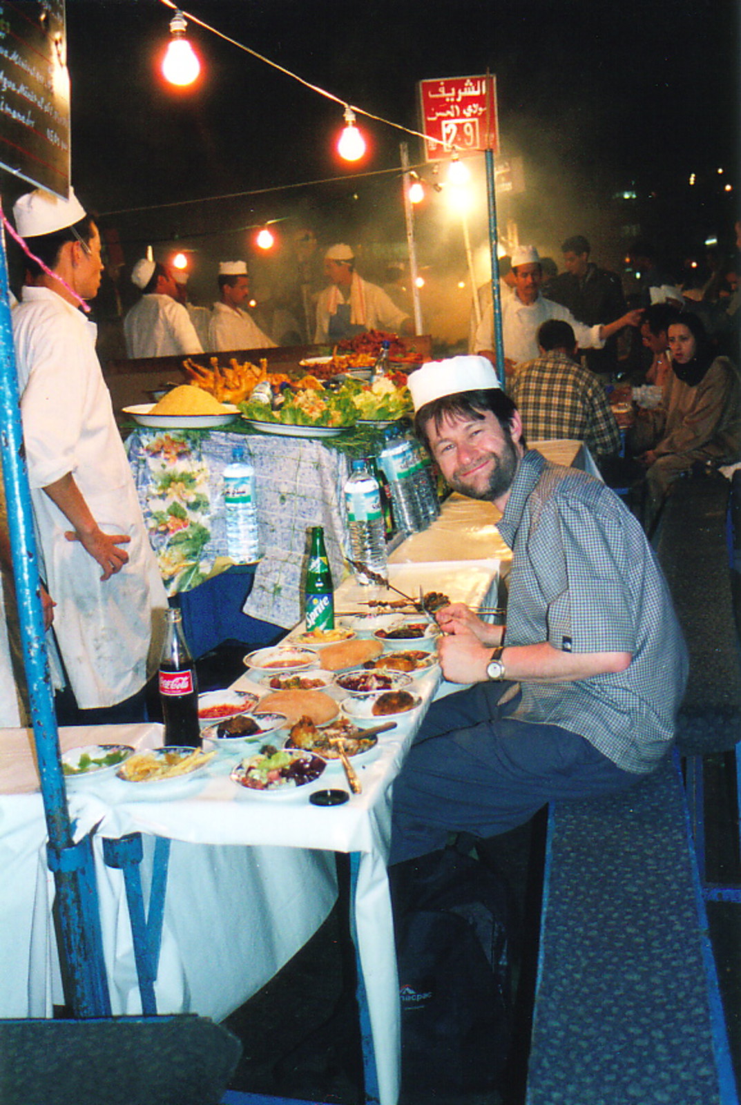 Mark eating in the Djemaa el-Fna at night