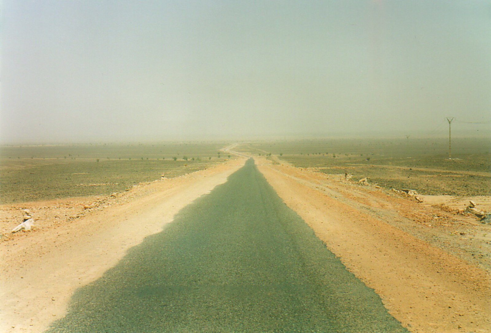A single-track road through the desert