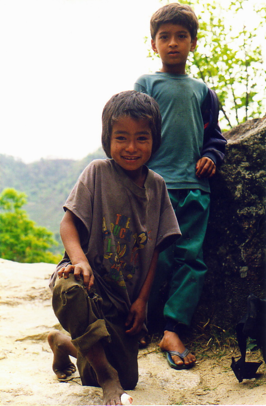 Two boys, one with a bandaged toe