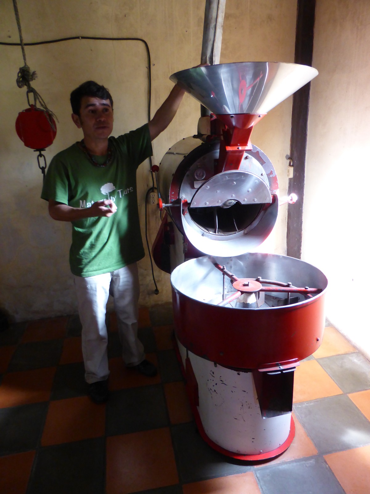 José demonstrating the roasting machine