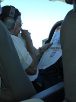 The pilot catching up on the news, mid-flight
