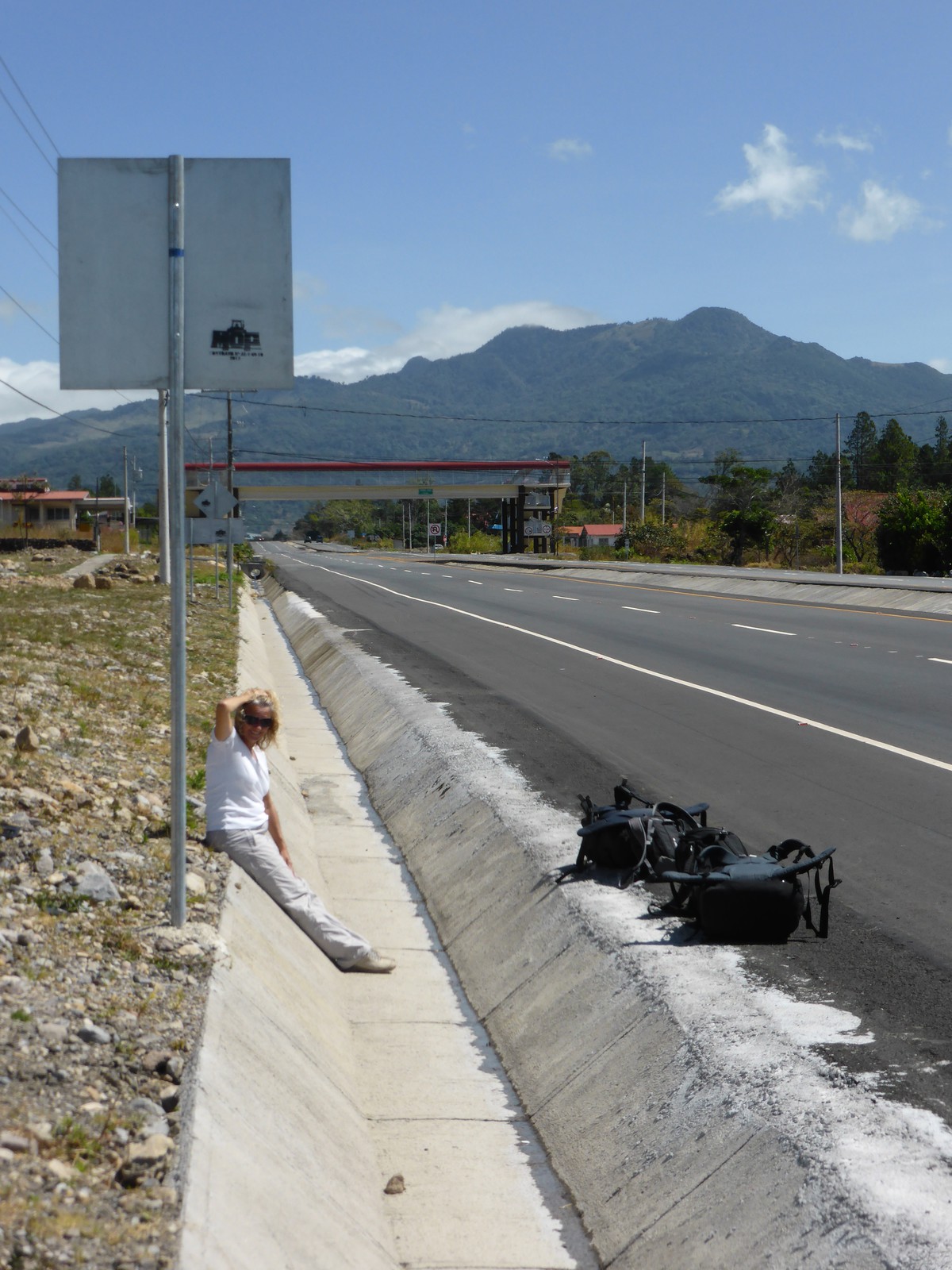 Peta sitting by the road in Boquete as we waited for the bus to David and on to Santiago