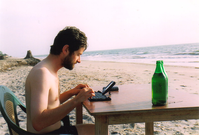 Mark writing on the beach at Palmarin