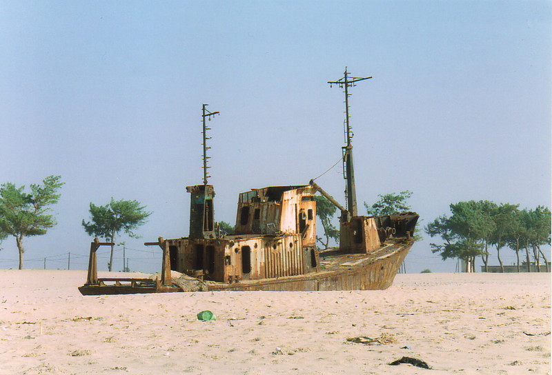 A rusty wrecked boat on St-Louis beach