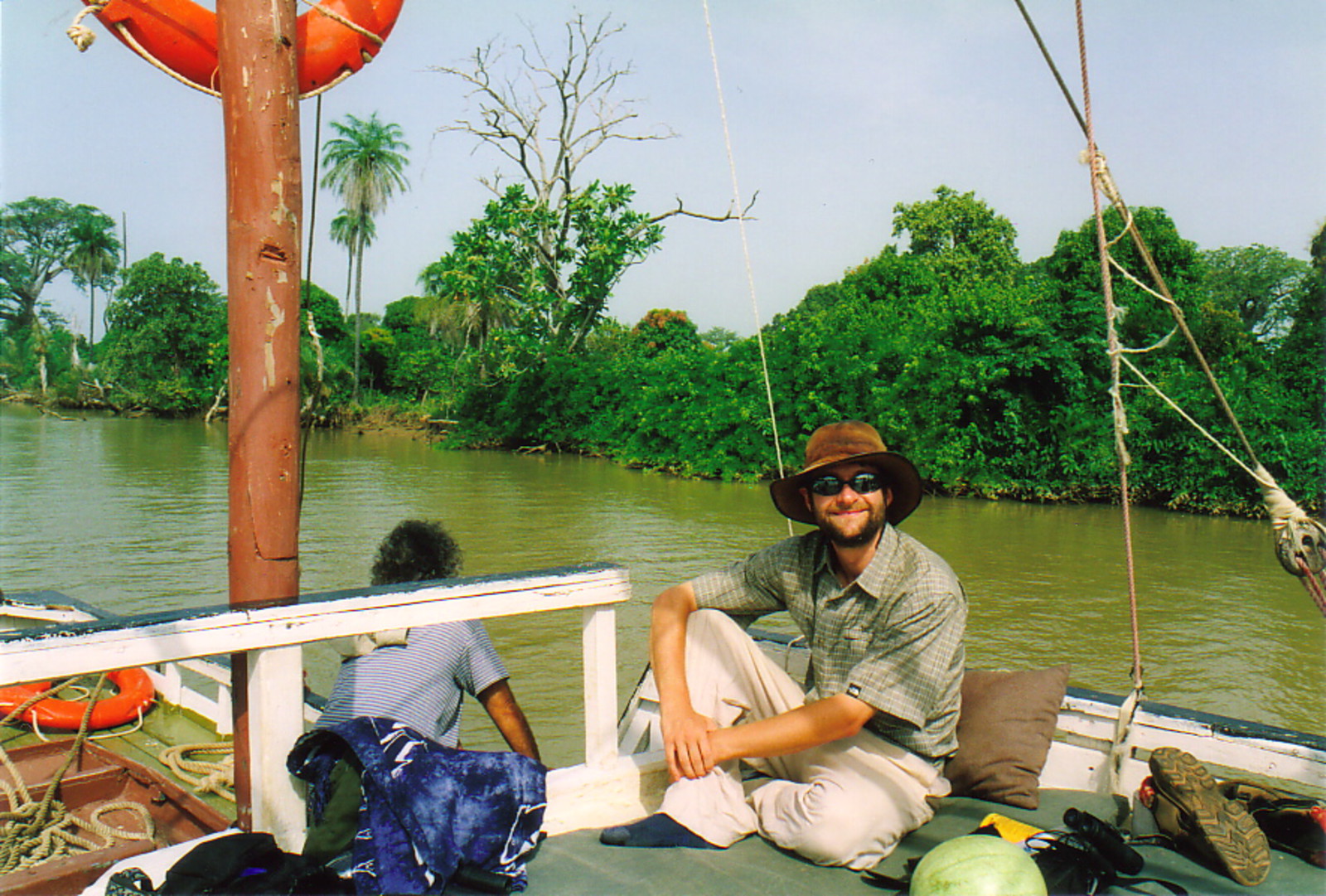 Mark relaxing on a boat on the River Gambia