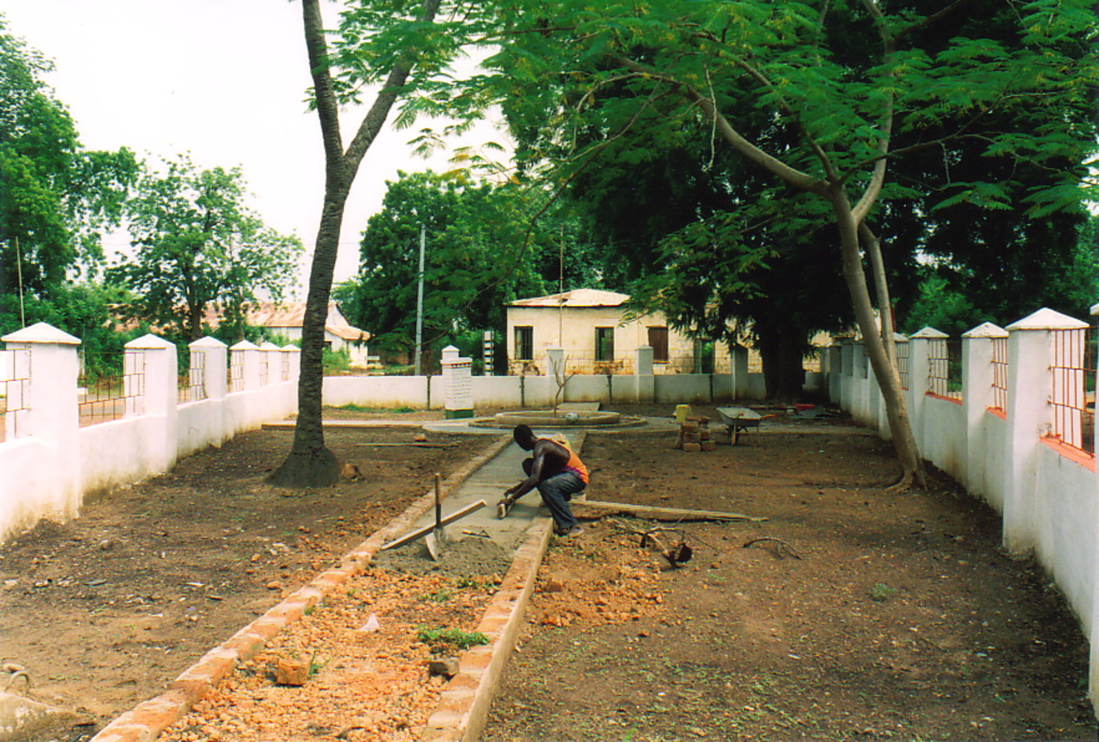 A man laying concrete at the Freedom Monument