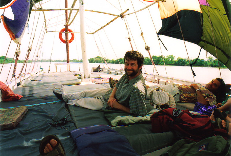 Mark relaxing on a boat on the River Gambia